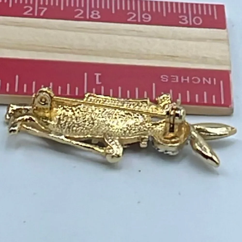 Vintage rhinestone enamel bunny tartan plaid golfer brooch.